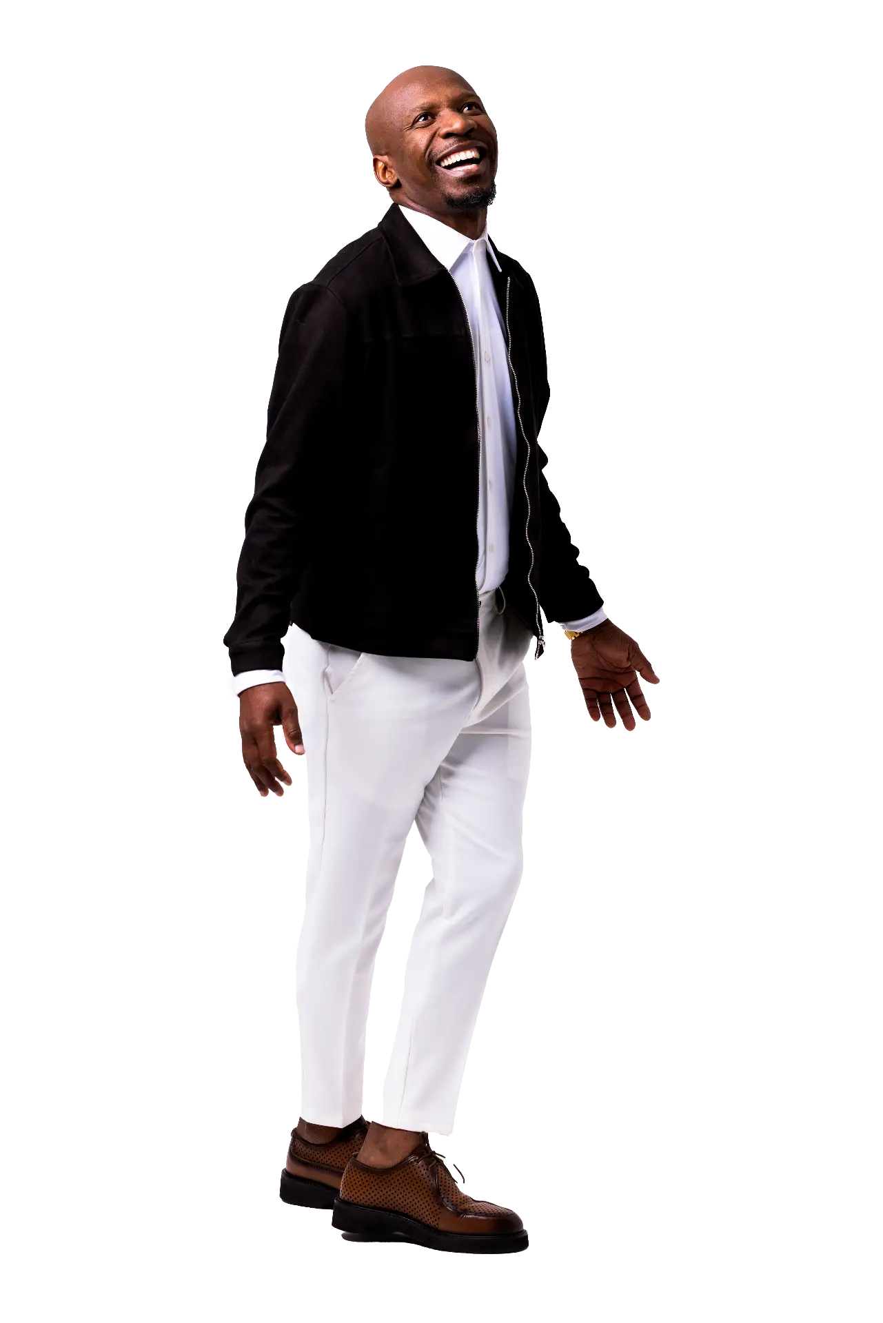 Teekay Netshideyi smiling, wearing a black jacket and white trousers